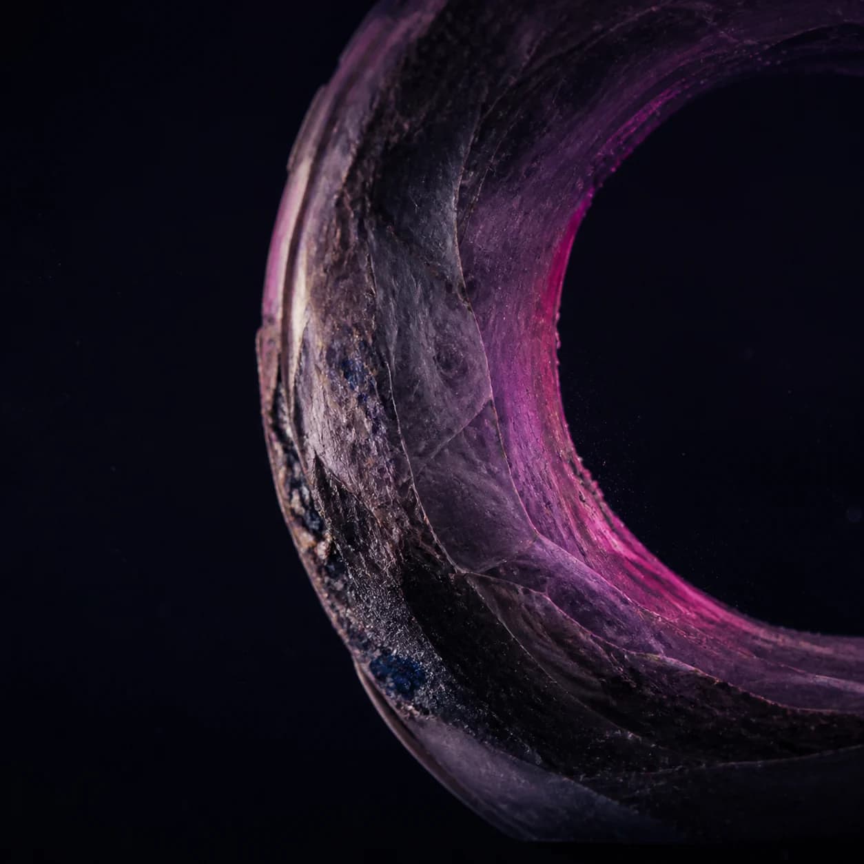 Abstract orbital forms made from glass, stone, and folded paper
